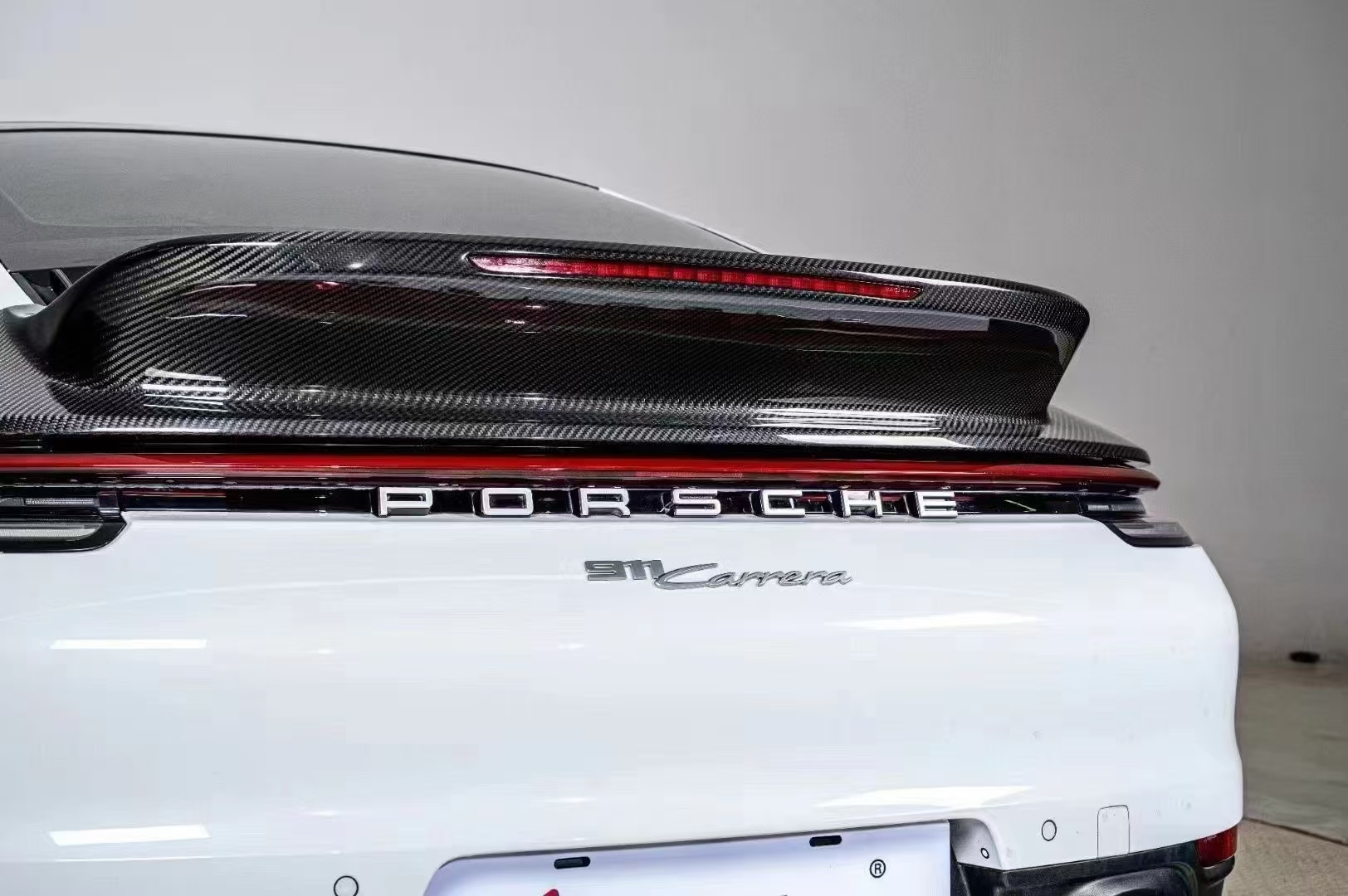 What is a Dry Carbon Ducktail Spoiler for Porsche 992?
